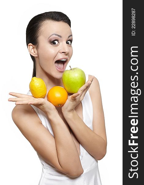 Portrait of beautiful happy smiling girl with fruits lemon and green apple and orange isolated on white. Portrait of beautiful happy smiling girl with fruits lemon and green apple and orange isolated on white