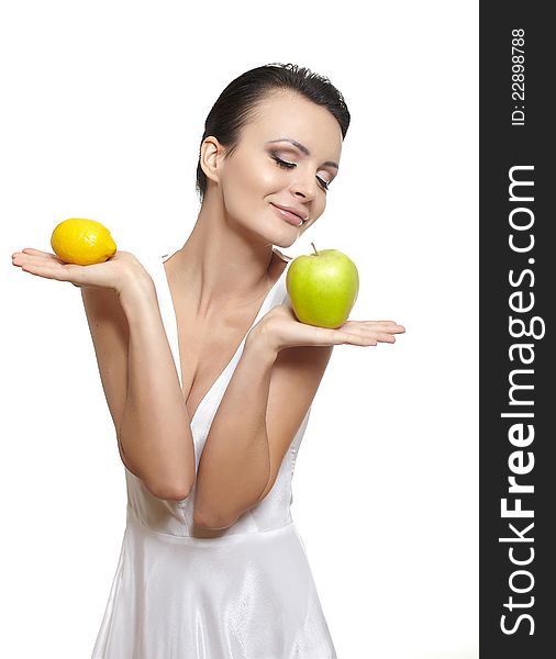 Portrait of beautiful happy smiling girl with  fruits lemon and green apple isolated on white. Portrait of beautiful happy smiling girl with  fruits lemon and green apple isolated on white