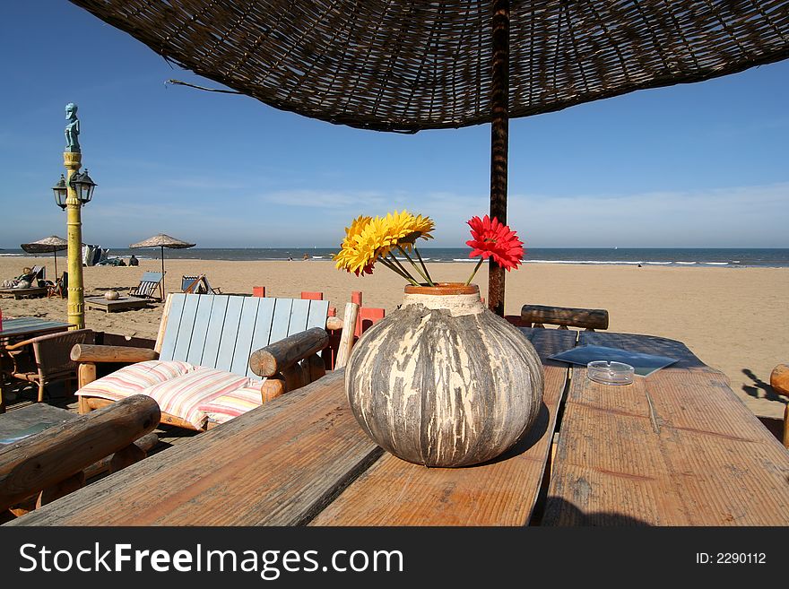 Table with flowers at a beach restaurant. Table with flowers at a beach restaurant