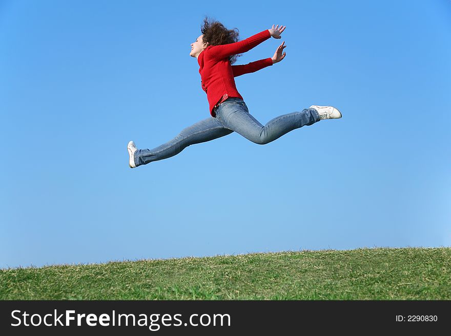 Jump girl on a background of the blue sky. Jump girl on a background of the blue sky