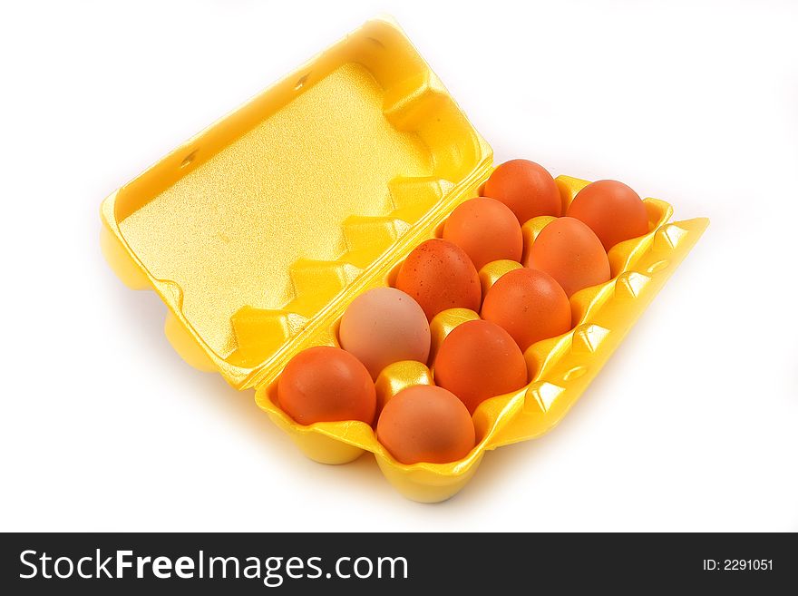 Ten chicken eggs in pack isolated on white background
