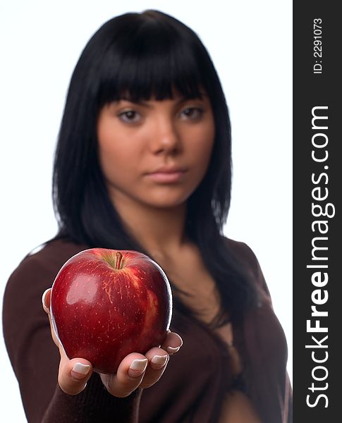 The girl with an apple on a white background