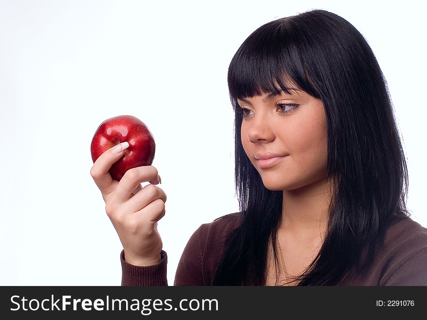 The girl with an apple on a white background