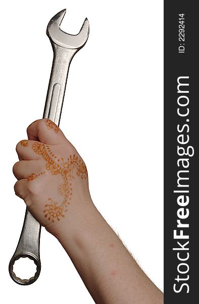 Woman's henna painted hand holding a large wrench. Woman's henna painted hand holding a large wrench