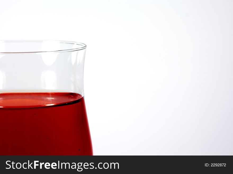 Red wine in glass on the white background