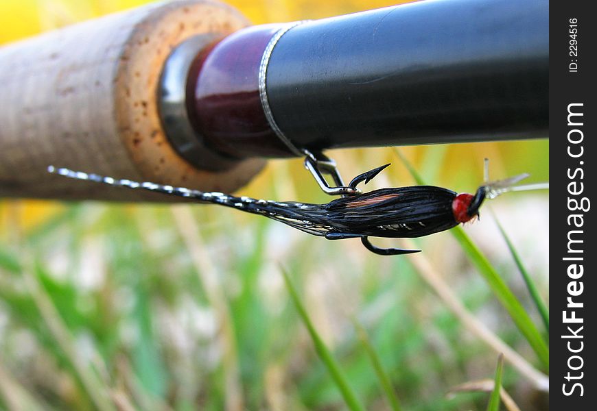 A fly hook and rod by the River Tweed, Scotland. A fly hook and rod by the River Tweed, Scotland.