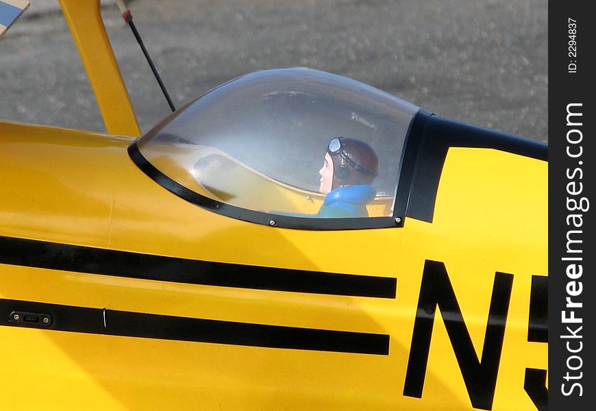 A model biplane and pilot.