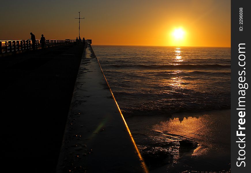 Down The Pier At Sunrise