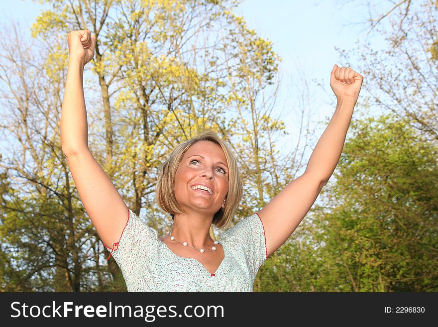 Attractive happy beauty woman in nature. Attractive happy beauty woman in nature