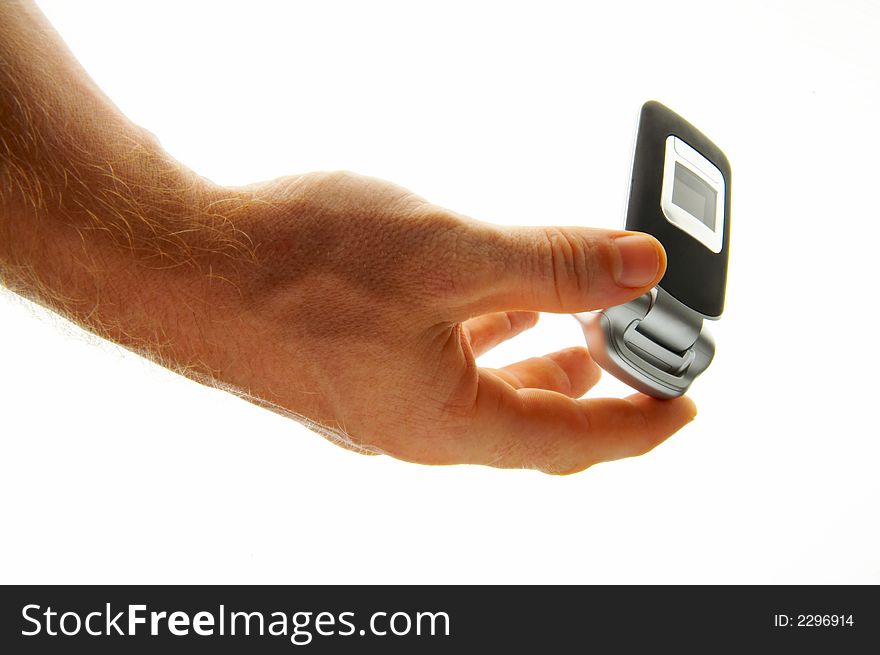 View of a man opening his mobile phone to make a call. View of a man opening his mobile phone to make a call