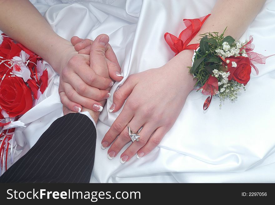 An image of a detail of a wedding dress. An image of a detail of a wedding dress