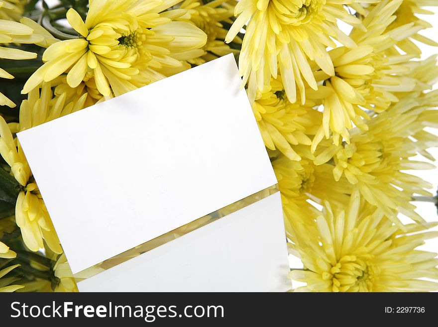 A bouquet of yellow flowers with a gift card. A bouquet of yellow flowers with a gift card