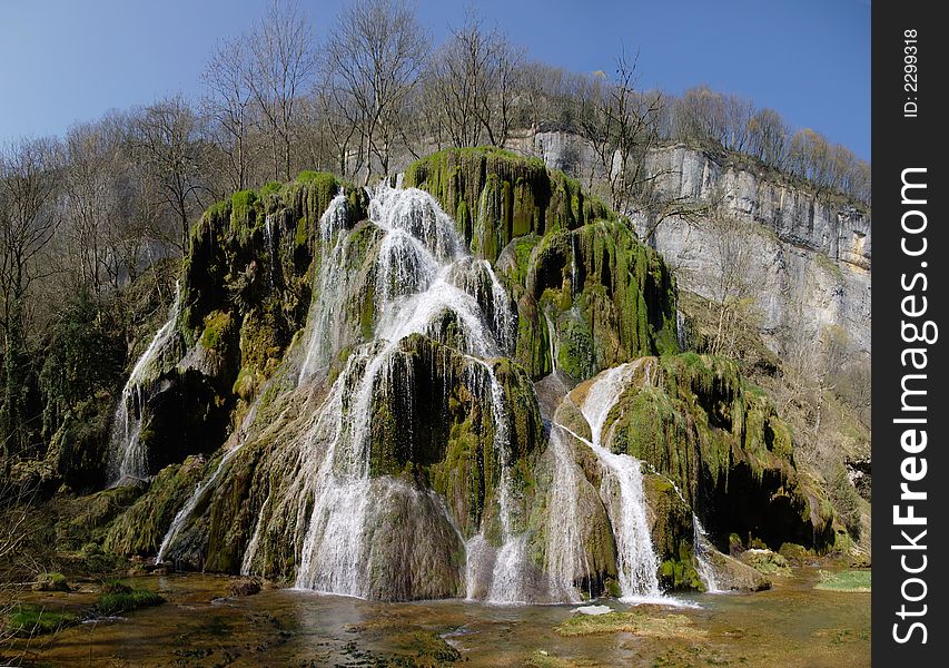Magnific waterfall stone green canion. Cirque Baume, France, Europe. Magnific waterfall stone green canion. Cirque Baume, France, Europe