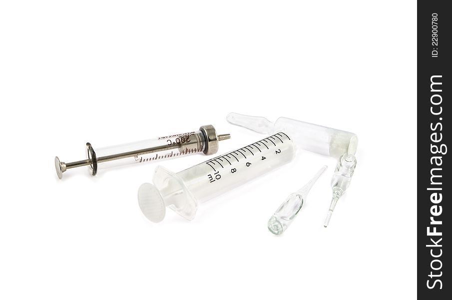 Syringes and ampoules on a white background