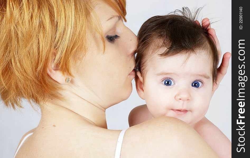 Portrait of a  happy mother and the little baby