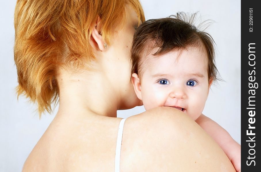 Portrait Of A  Happy Mother And The Little Baby