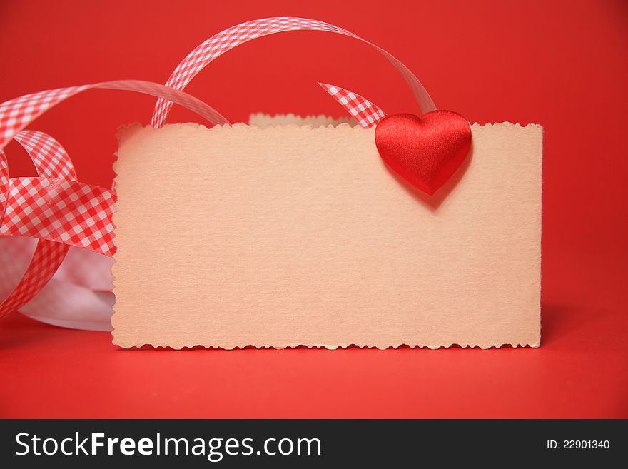 Red heart on the card, valentine, red background. Red heart on the card, valentine, red background