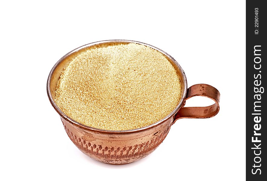 Brown sugar in a cup isolated white background