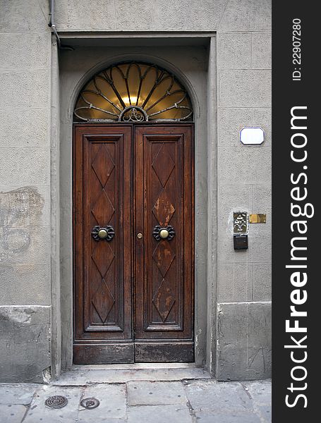 Closeup of gray wall with nice old wooden door. Closeup of gray wall with nice old wooden door