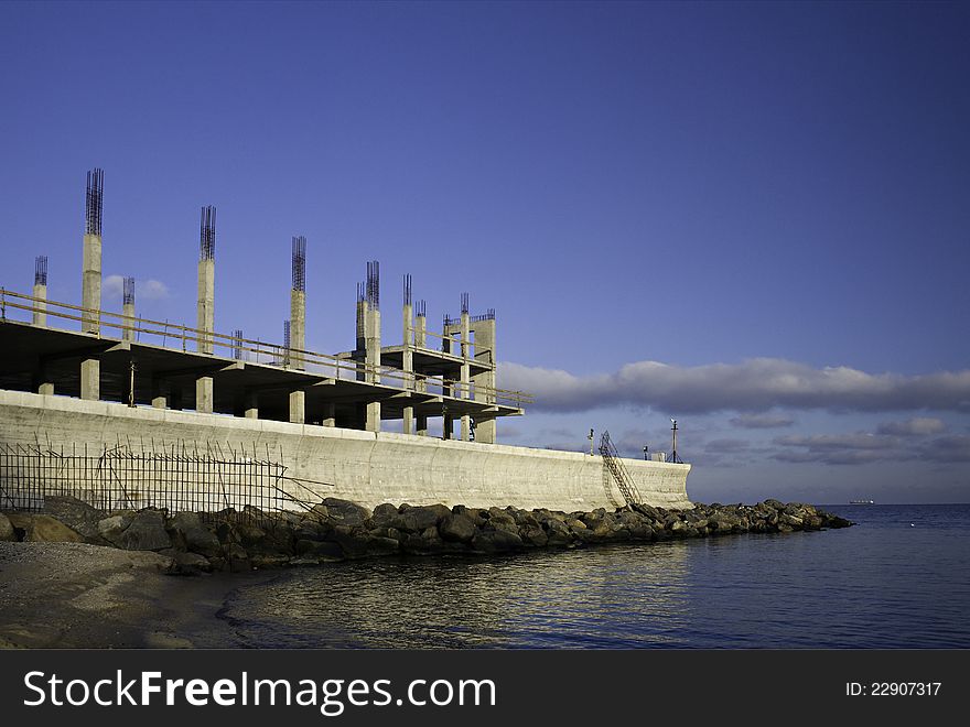 Construction of contemporary buildings on the shore of the sea. Construction of contemporary buildings on the shore of the sea.