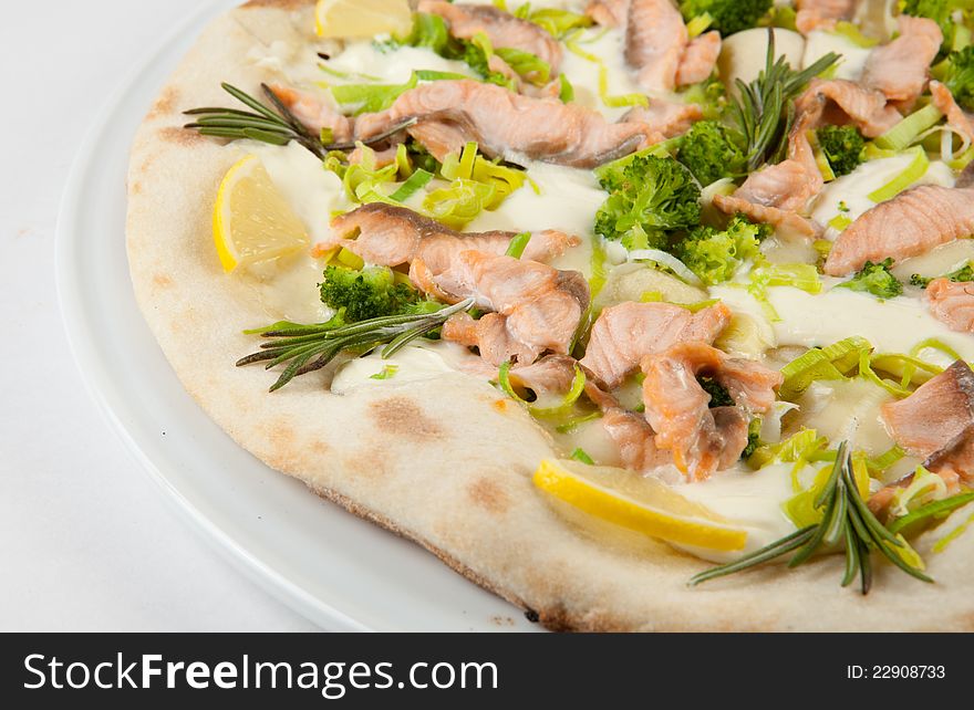 White pizza with lemon and salmon