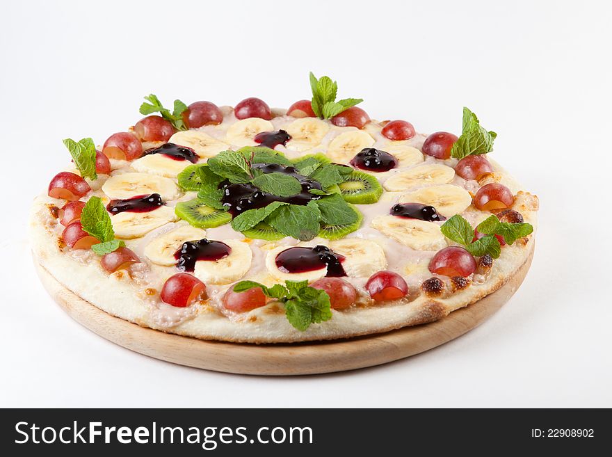 Sweet fruity round pizza on a white. Sweet fruity round pizza on a white