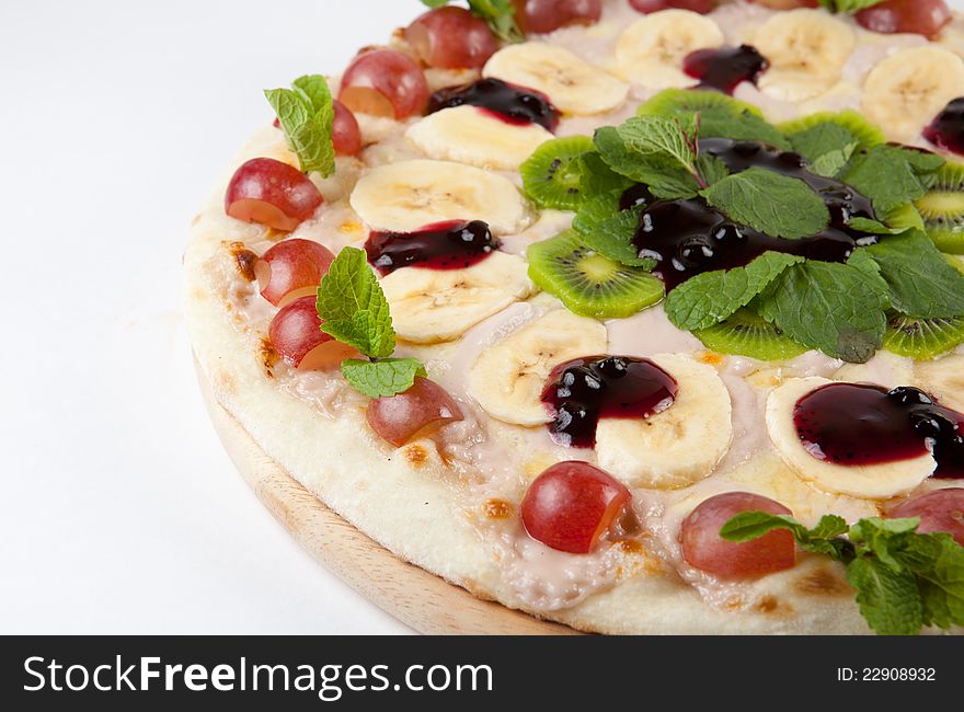 Sweet fruity round pizza on a white. Sweet fruity round pizza on a white