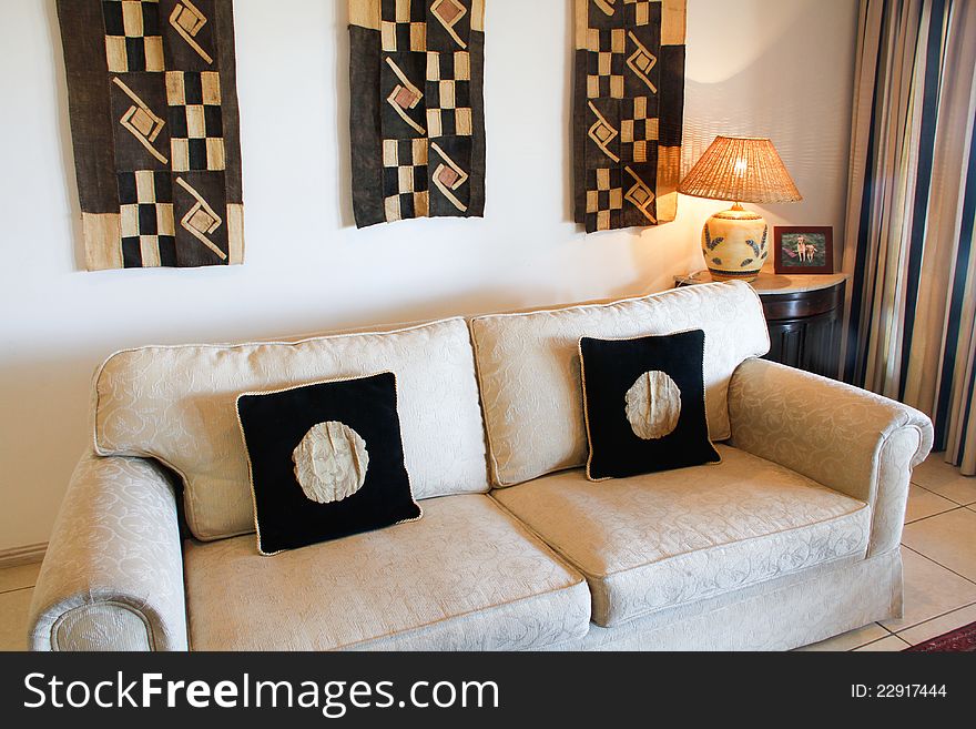Designers couch with cushions and lamp in luxury theme home. Designers couch with cushions and lamp in luxury theme home