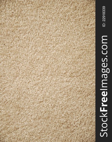 A span of neutral beige nubby rug image to use as a background or backdrop. A span of neutral beige nubby rug image to use as a background or backdrop
