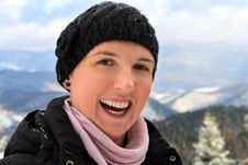 Happy Young Woman With A Big Smile On Her Face, Spending Her Winter Holiday In A Mountain Cabin, Happiness Concept Stock Image Happy Young Woman With A Big Smile On Her Face, Spending Her Winter Holiday In A Mountain Cabin, Happiness Concept Stock Image