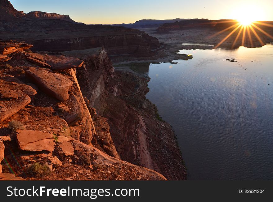 Sunrise on the edge of White Canyon at Glen Canyon Recreation Area. Sunrise on the edge of White Canyon at Glen Canyon Recreation Area.