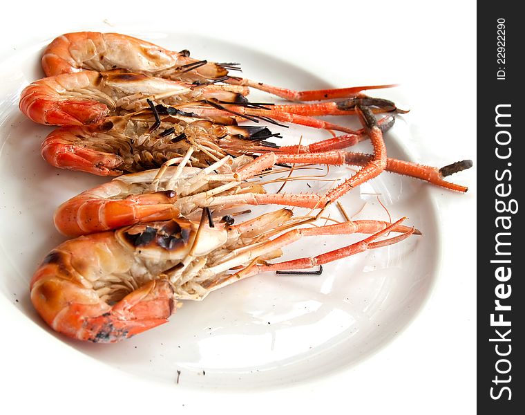 Grilled shrimp on white dish