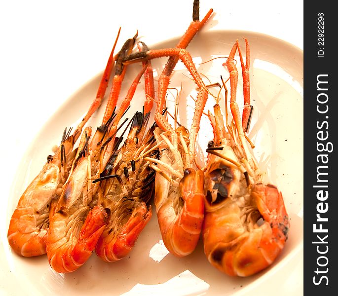 Grilled shrimp on white dish