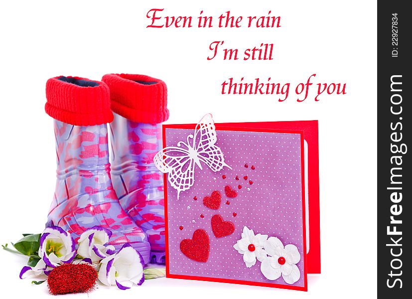 Rubber boots and a valentine greeting card. Rubber boots and a valentine greeting card