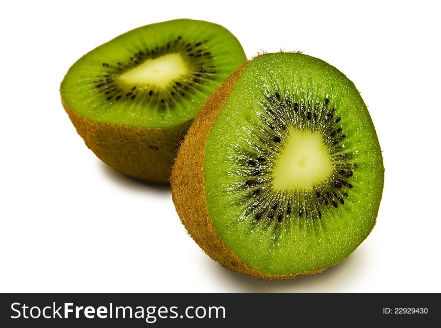 Kiwi fruit halves on a white backgroundrn. Kiwi fruit halves on a white backgroundrn