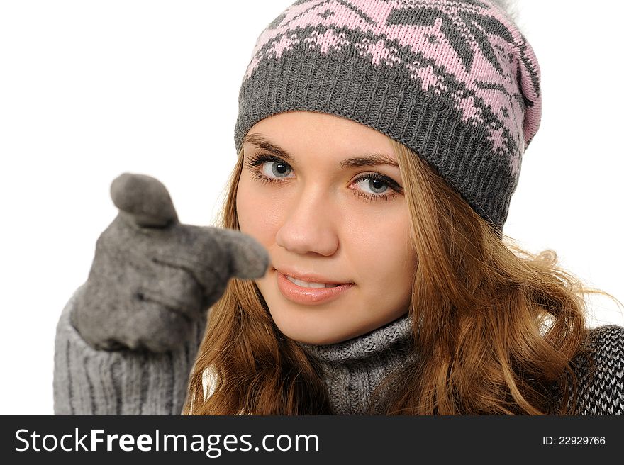 Woman iin a cap pointing at you, isolated on white background. Woman iin a cap pointing at you, isolated on white background