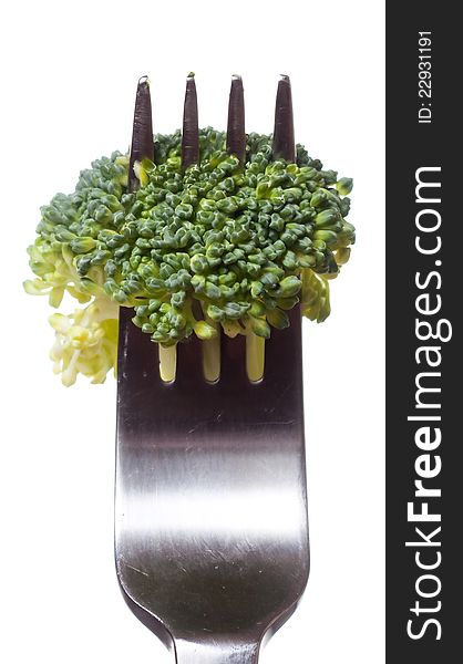 Broccoli on fork isolated on white