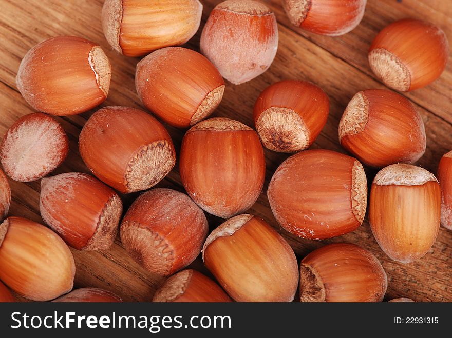 Studio photo of some filbert nuts over wooden background. Studio photo of some filbert nuts over wooden background