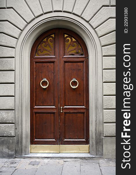 Fragment of old stone building with nice wooden door. Fragment of old stone building with nice wooden door