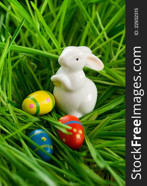 Easter rabbit and eggs on  grass