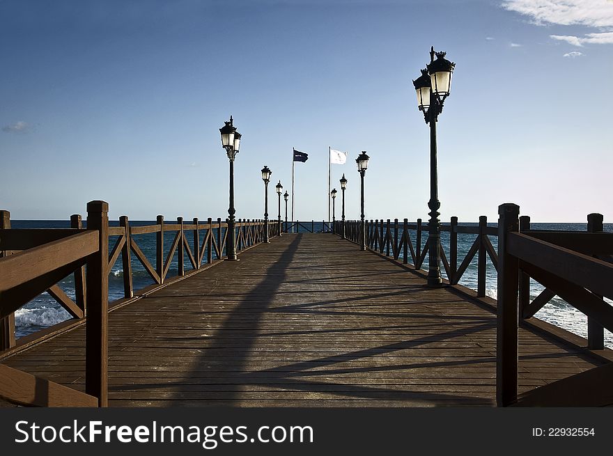 A wood pier in Marbella (Costa del Sol), Spain. A wood pier in Marbella (Costa del Sol), Spain