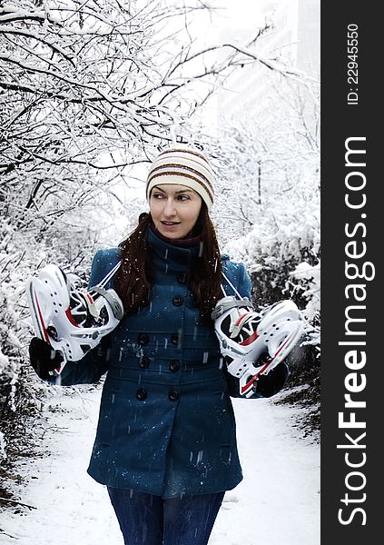 Girl with ice skates on a winter day. Girl with ice skates on a winter day