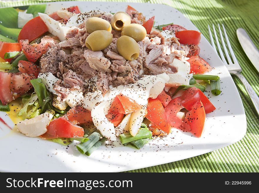 Tuna salad with tomato and olives