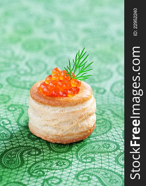 Vol-au-vent filled with red caviar, selective focus. Vol-au-vent filled with red caviar, selective focus