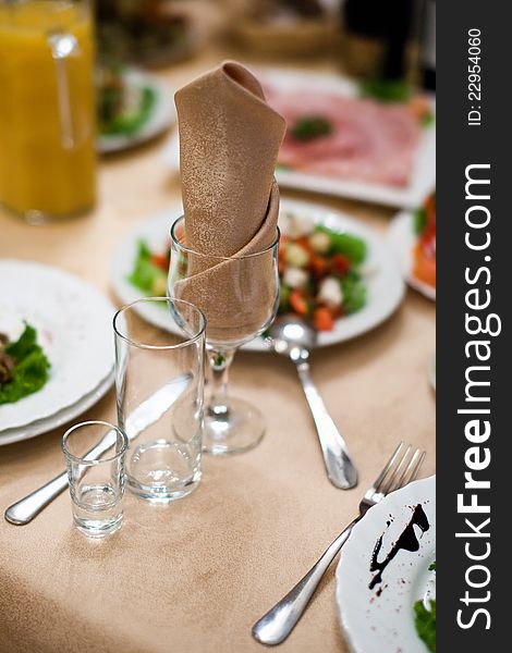 Table with wineglass and napkin in restaurant