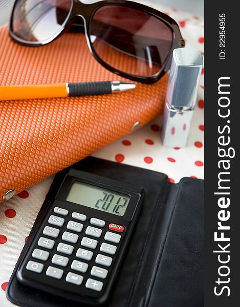 Close up calculator on working table lady style. Close up calculator on working table lady style