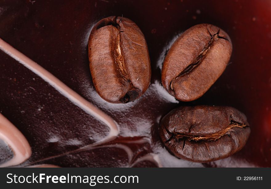 Macro shoot of Coffee cake with three coffee beans background. Macro shoot of Coffee cake with three coffee beans background