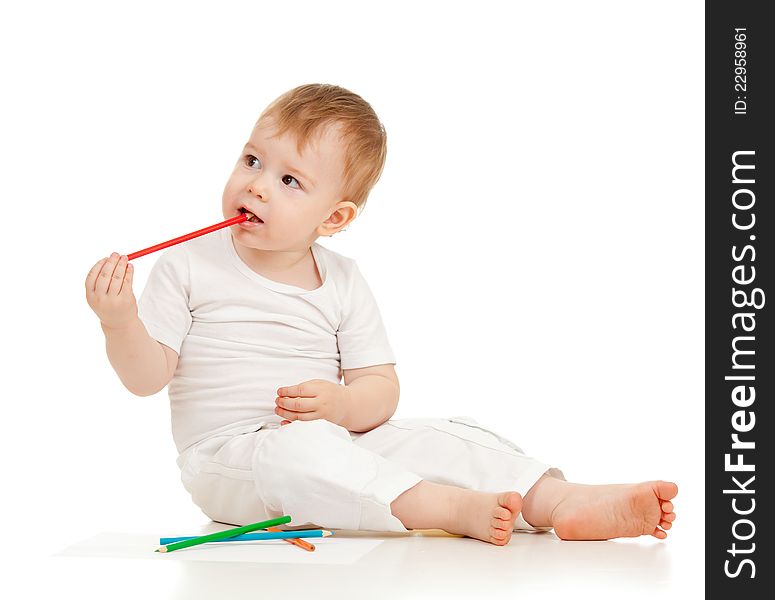 Funny baby boy drawing with color pencils. Funny baby boy drawing with color pencils