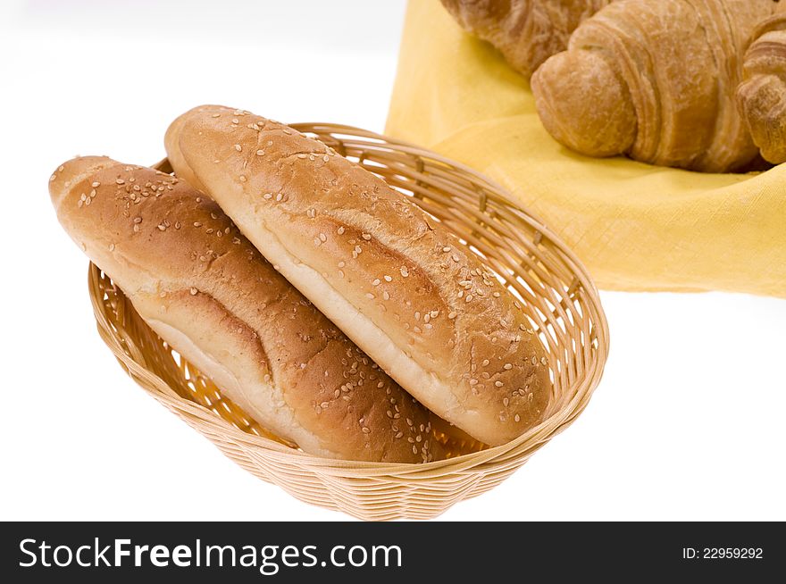 Sweet bread food in a basket over white background