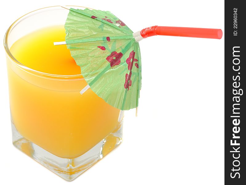 A glass of orange juice with an umbrella straw isolated on a white background. A glass of orange juice with an umbrella straw isolated on a white background